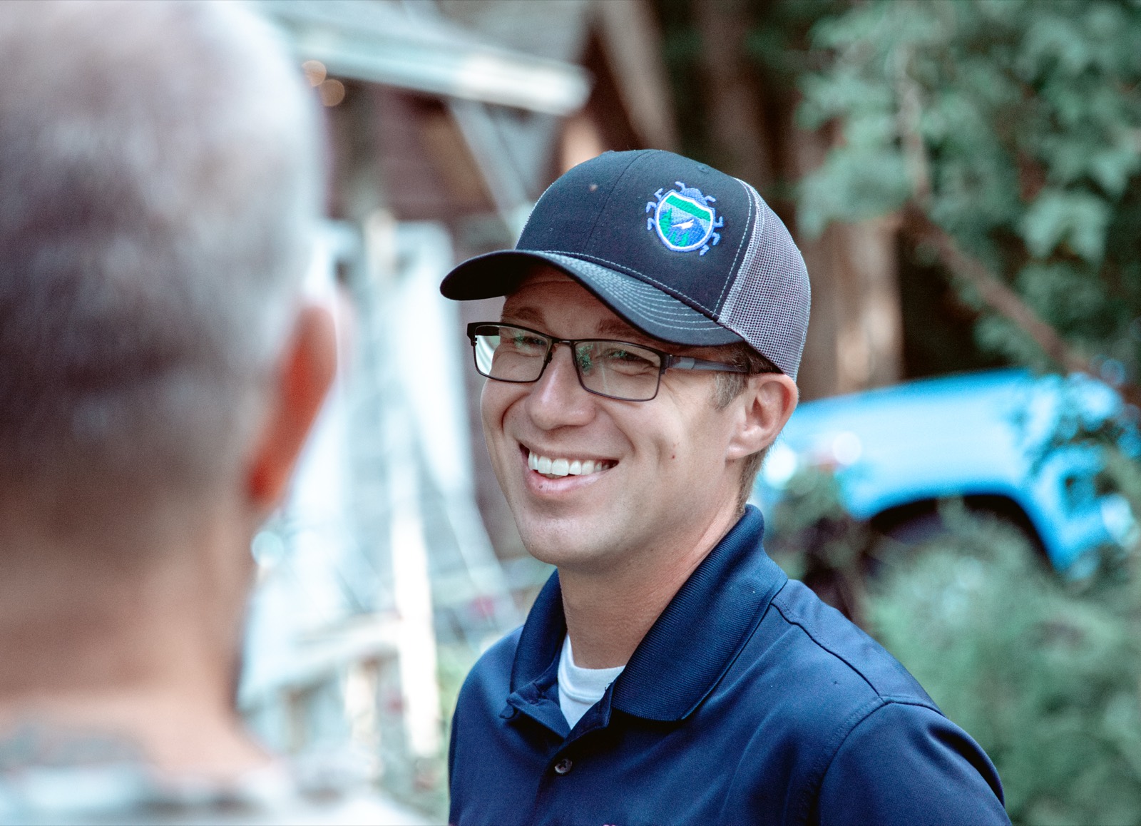 Interstate Pest Management technician with a customer in Olympia