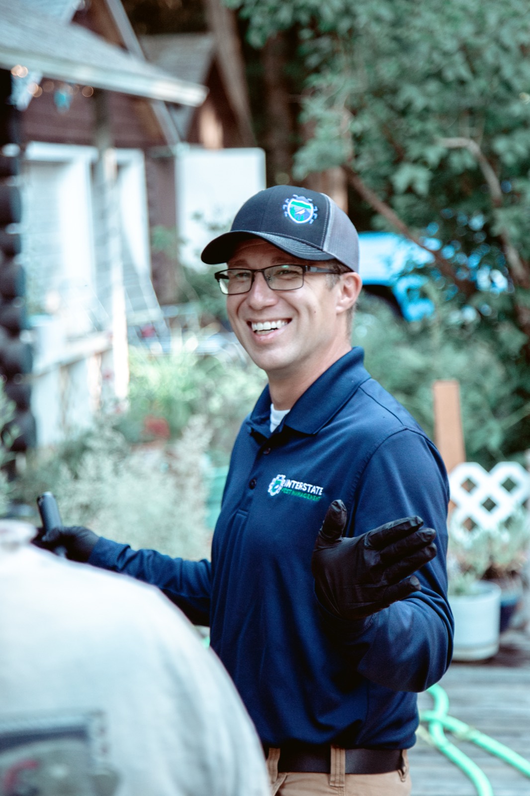 Interstate Pest Management technician in branded uniform in Olympia